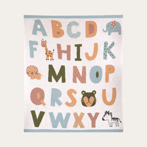 Folded mint and cream alphabet baby blanket made from organic cotton