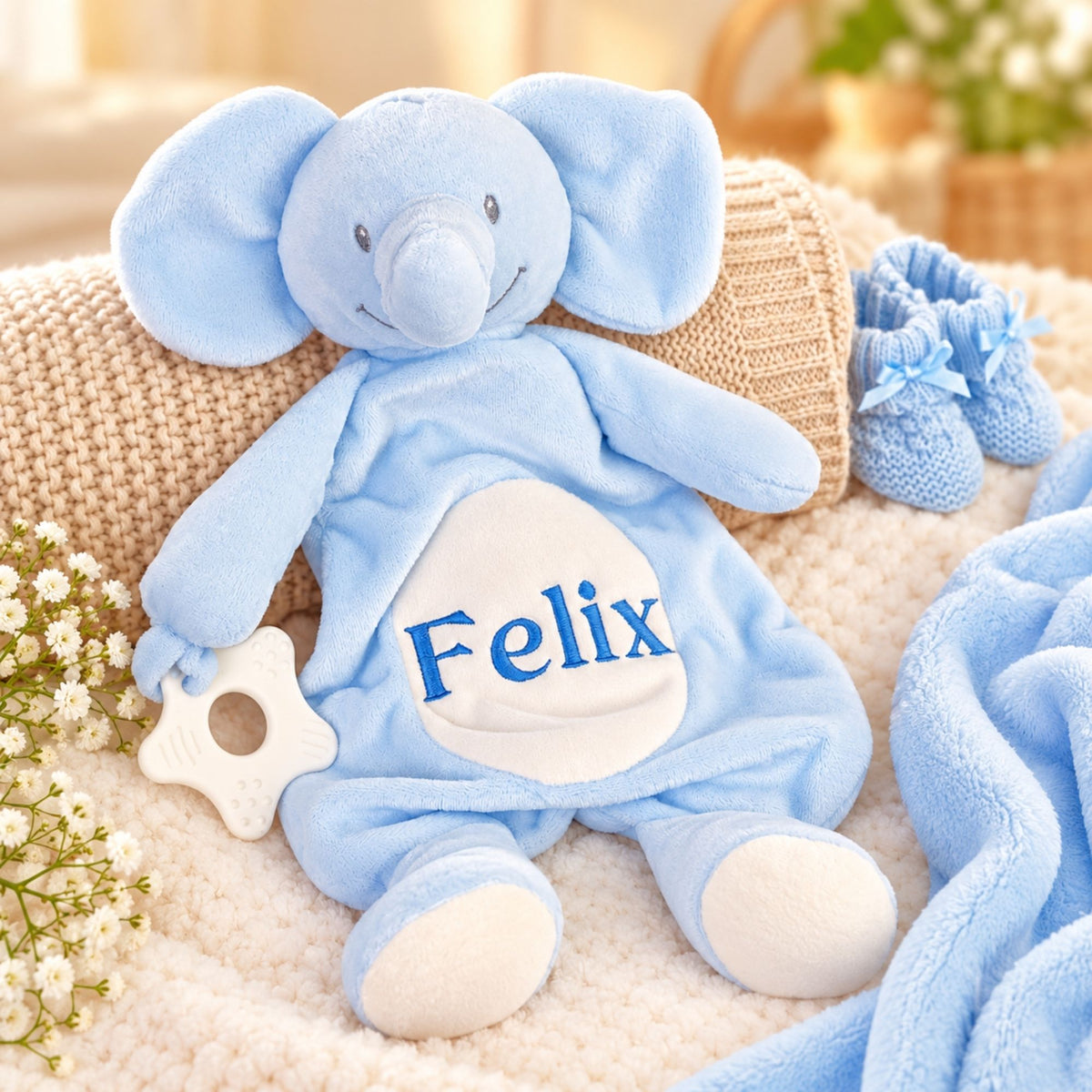 Personalised baby comforter with a customised name ‘Felix’ embroidered across the middle