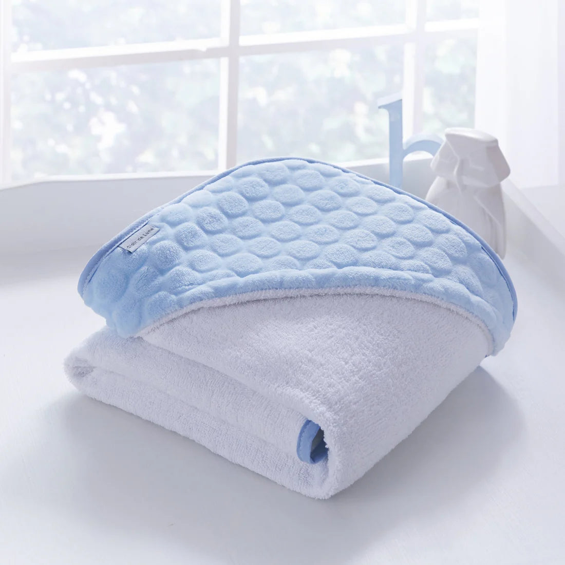 White and blue baby hooded bath towel.