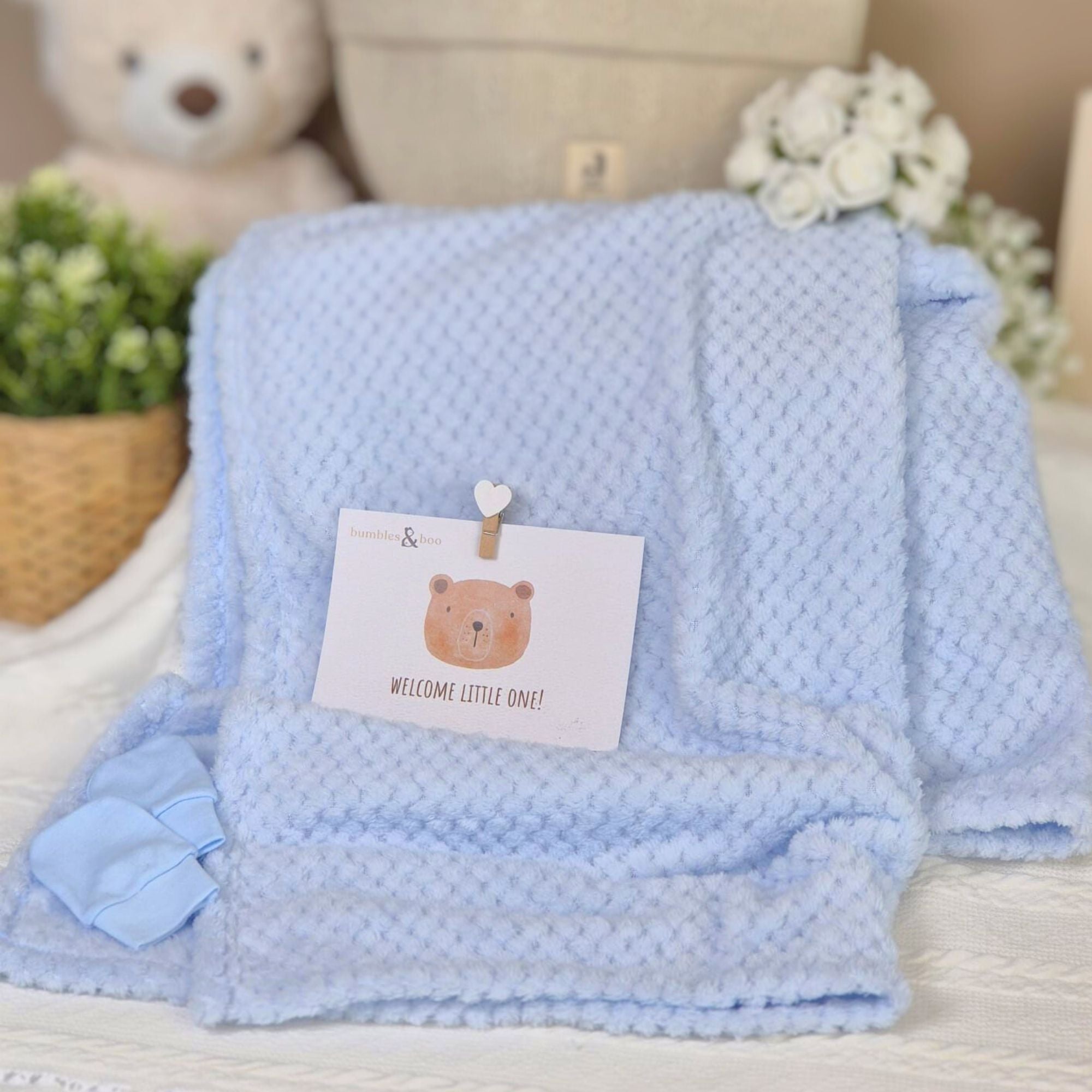 Baby blanket in soft baby boy blue with a waffle texture
