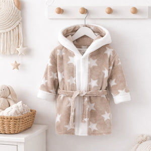 A beige baby bath robe with white stars and a little hood. Perfect for baby bath time.