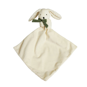 Front view of bunny comforter with cream blanket spread below the green bow
