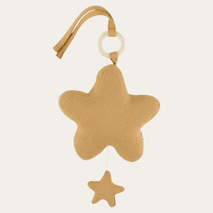Cocoon Caramel star music box showing textured fabric, hanging straps, top ring and small star-shaped pull.