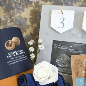 close up of salted caramel chocolates and a pregnancy countdown frame