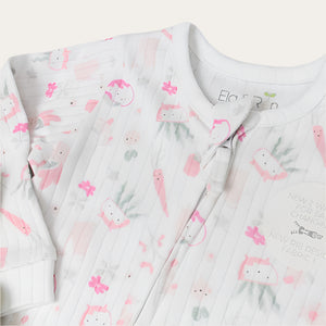 Closeup baby girl clothing plant print sleepsuit