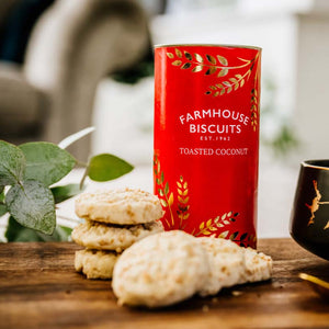 Sweet coconut biscuits in festive red and gold foil tube