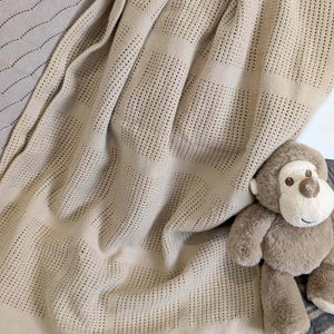 Beige cellular baby blanket with monkey