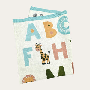 Soft and breathable cream and blue organic alphabet baby blanket texture