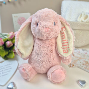 Pink soft toy bunny with pink personalisation shown on ear. Ideal baby girl gift or new baby gift.