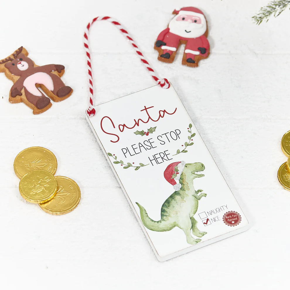 A cute hanging door plaque with a dinosaur for the door handle with the sentiment 'Santa Please Stop Here'