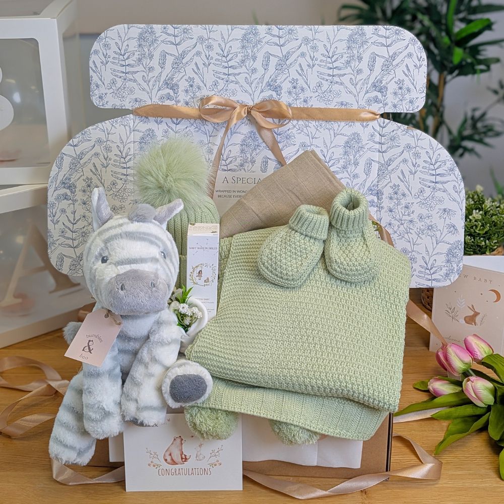 New baby gifts box with knit blanket set and zebra soft toy.