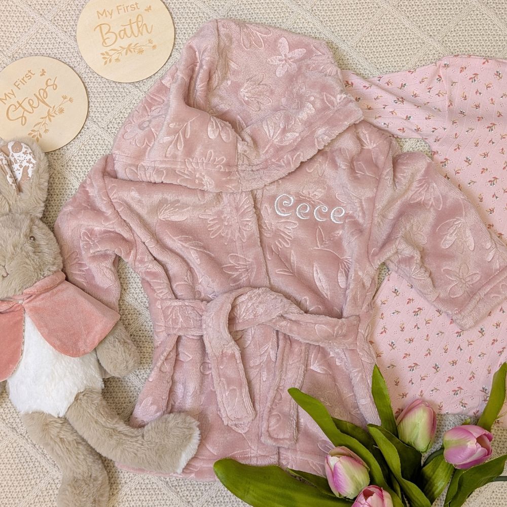 Dusky pink baby dressing gown which can be personalised with baby's name.