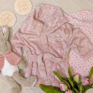 Dusky pink baby dressing gown which can be personalised with baby's name.