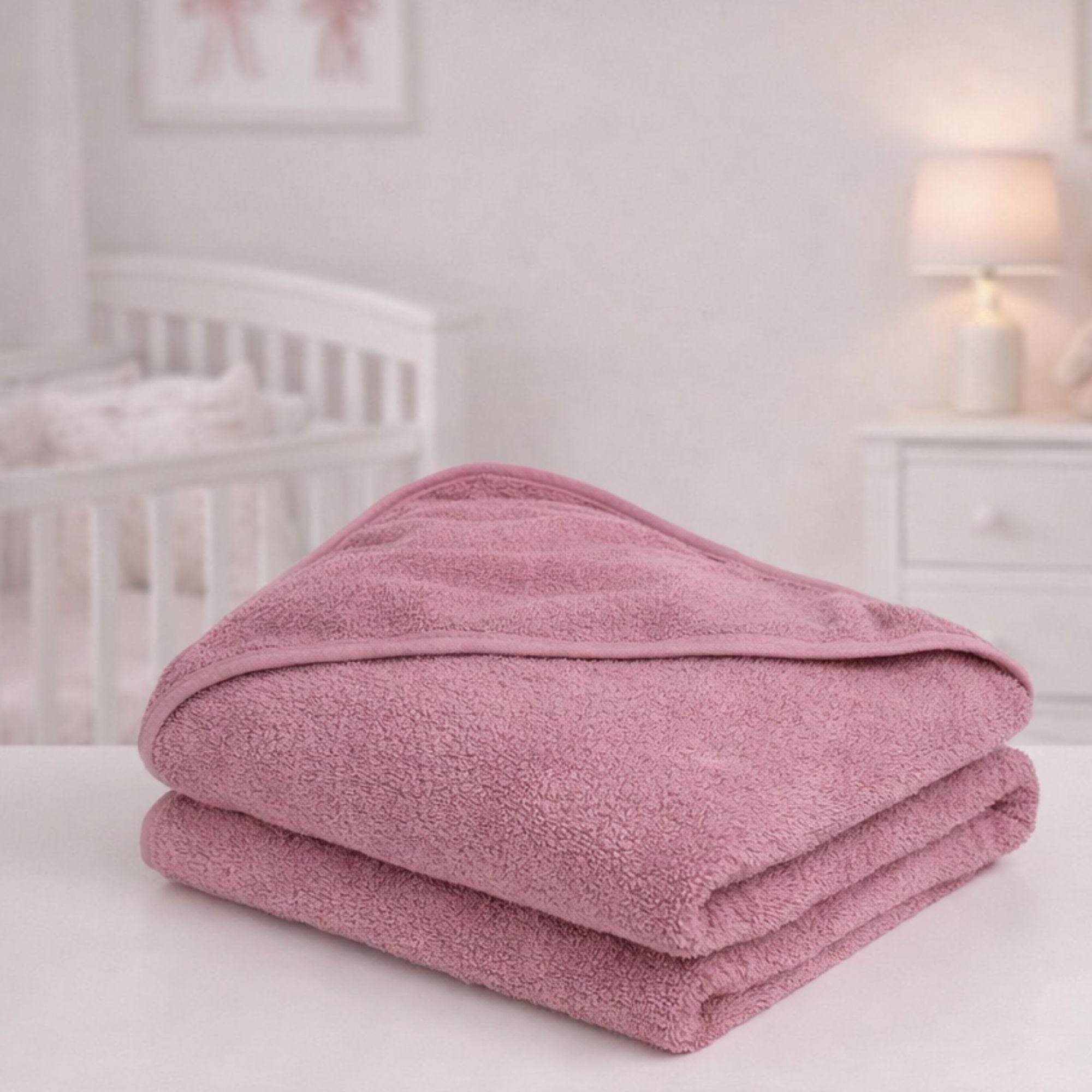 Pink hooded baby bath towel in dusky pink