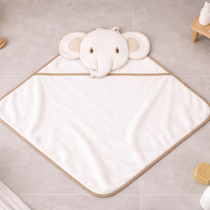 White baby bath towel with elephant hood and beige trim.