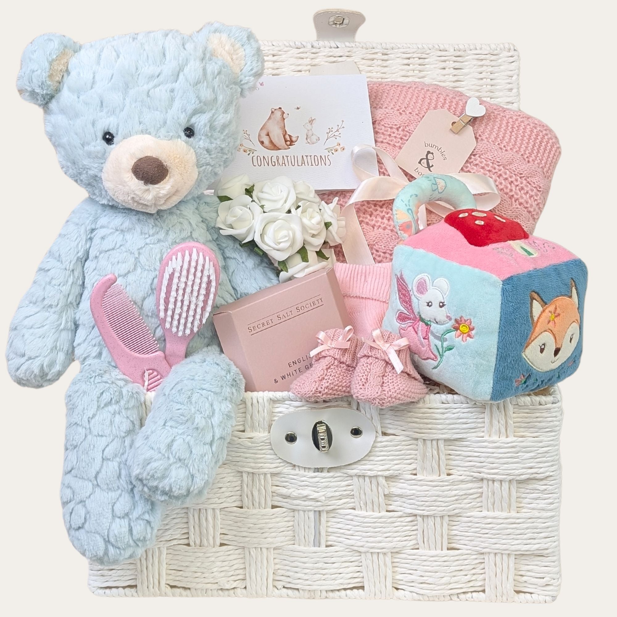 Luxury baby girl gifts hamper featuring a soft mint teddy bear and fairyland sensory activity cube. Perfect present.