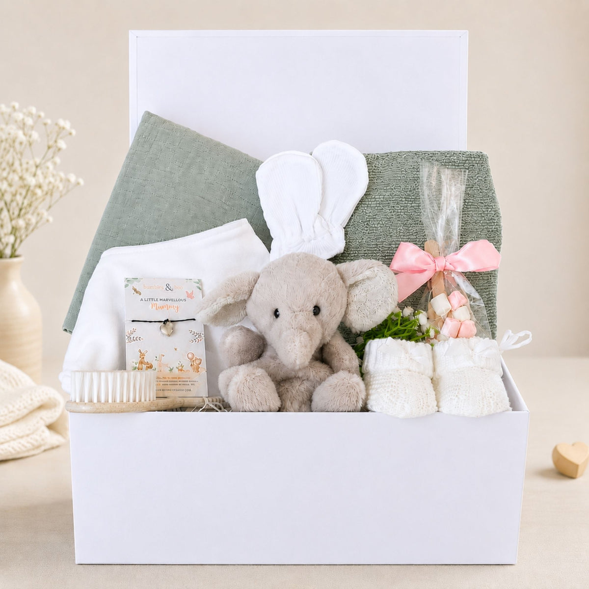 Baby gift box hamper with a little elephant and chocolate stirrer for mum