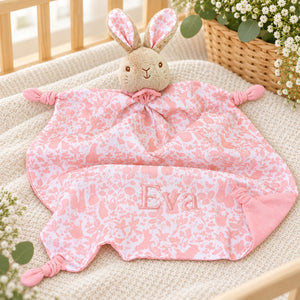 Pink floral baby comforter with bunny soft toy attached to the blanket, embroidered with the name Eva