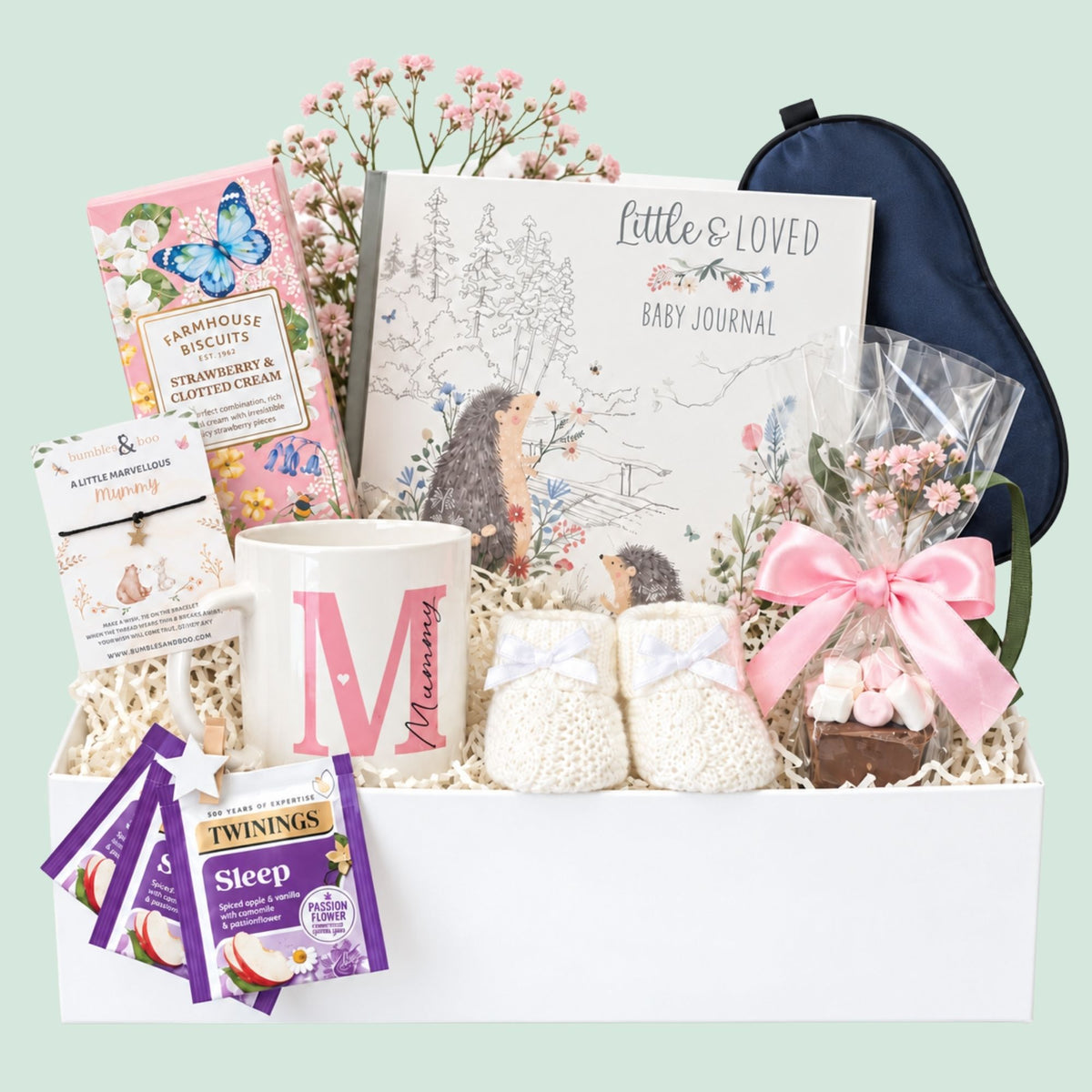 A gift box for a new mummy which includes delicious biscuits, a mummy mug and relaxation tea