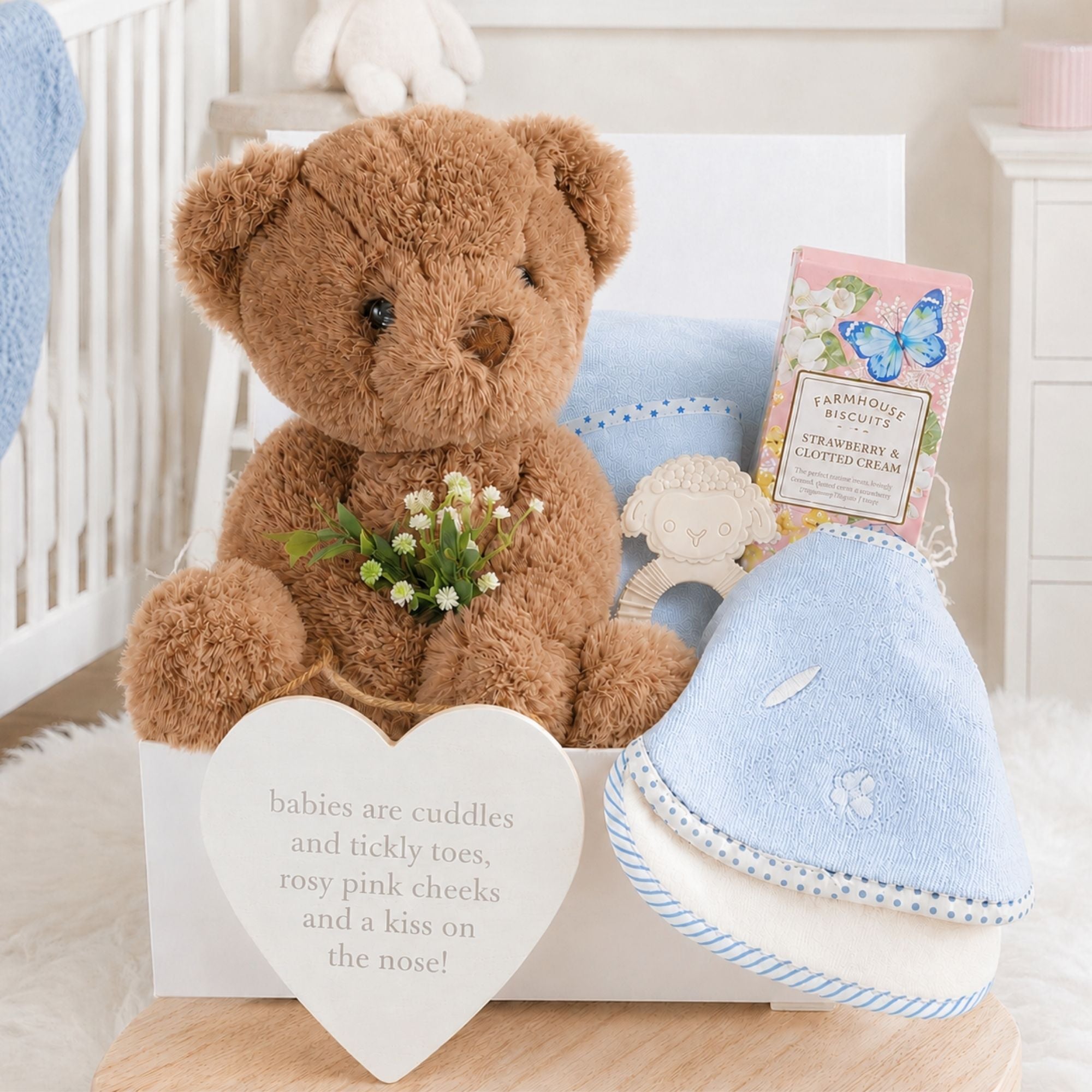 Gifts for new mum which include strawberry biscuits, personalised brown teddy bear.