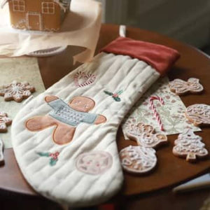 Organic baby christmas stocking with a gingerbread man theme.