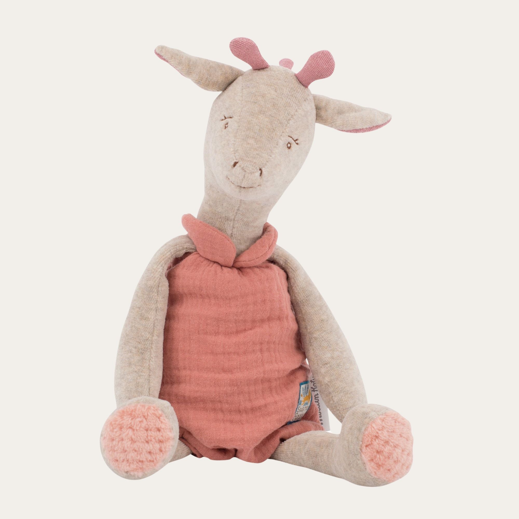 Giraffe soft cuddle baby toy with coral dungarees. Moulin Roty.