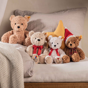 Granulate-filled plush teddy – tactile comfort toy with festive charm