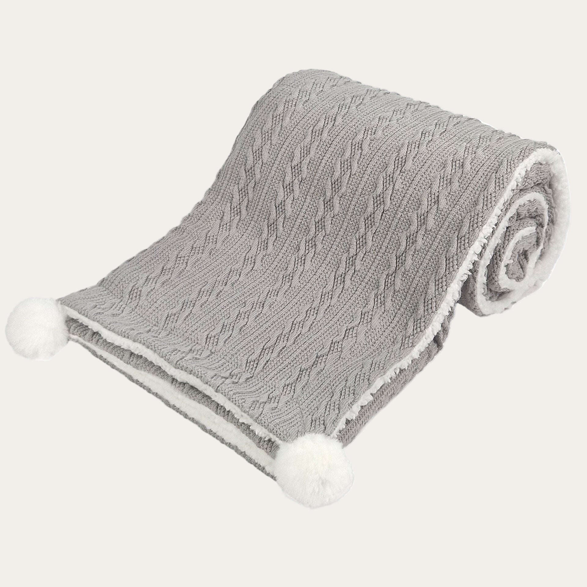Grey cable knit baby blanket with fleece-style lining
