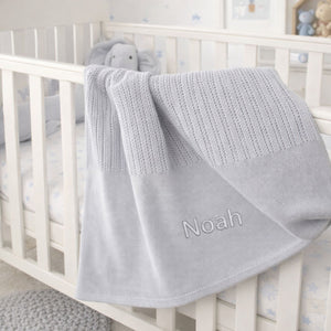 A grey cotton cellular baby blanket which can be personalised with baby name.