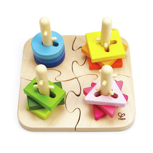 Hape wooden peg puzzle with four interlocking bases and colourful stacking shapes on a white background.