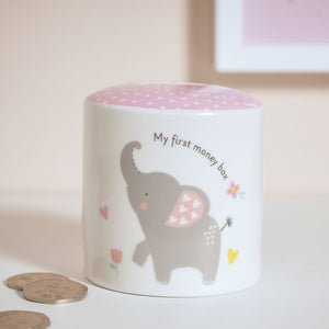 Children's money box with elephant design and pink top, featuring the text 'My first money box'.