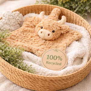Highland cow comforter in a basket