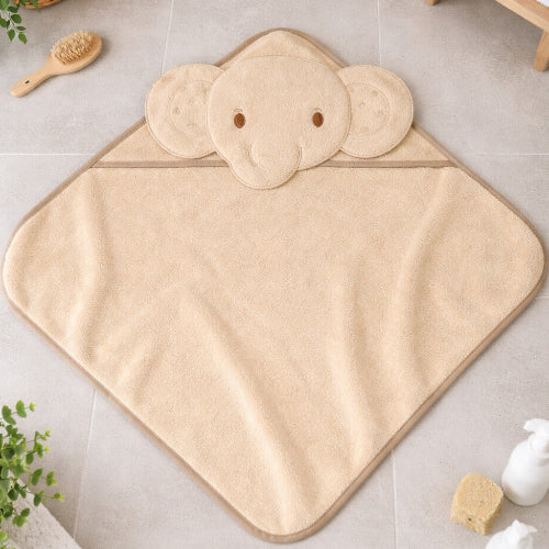 Beige / taupe elephant hooded newborn baby towel on bathroom floor