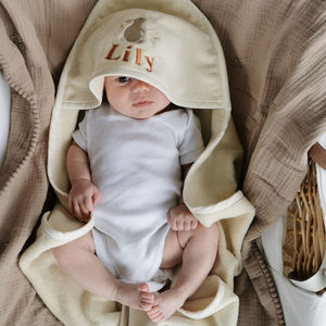 Personalised organic newborn baby towel with a bunny motif on the hood.