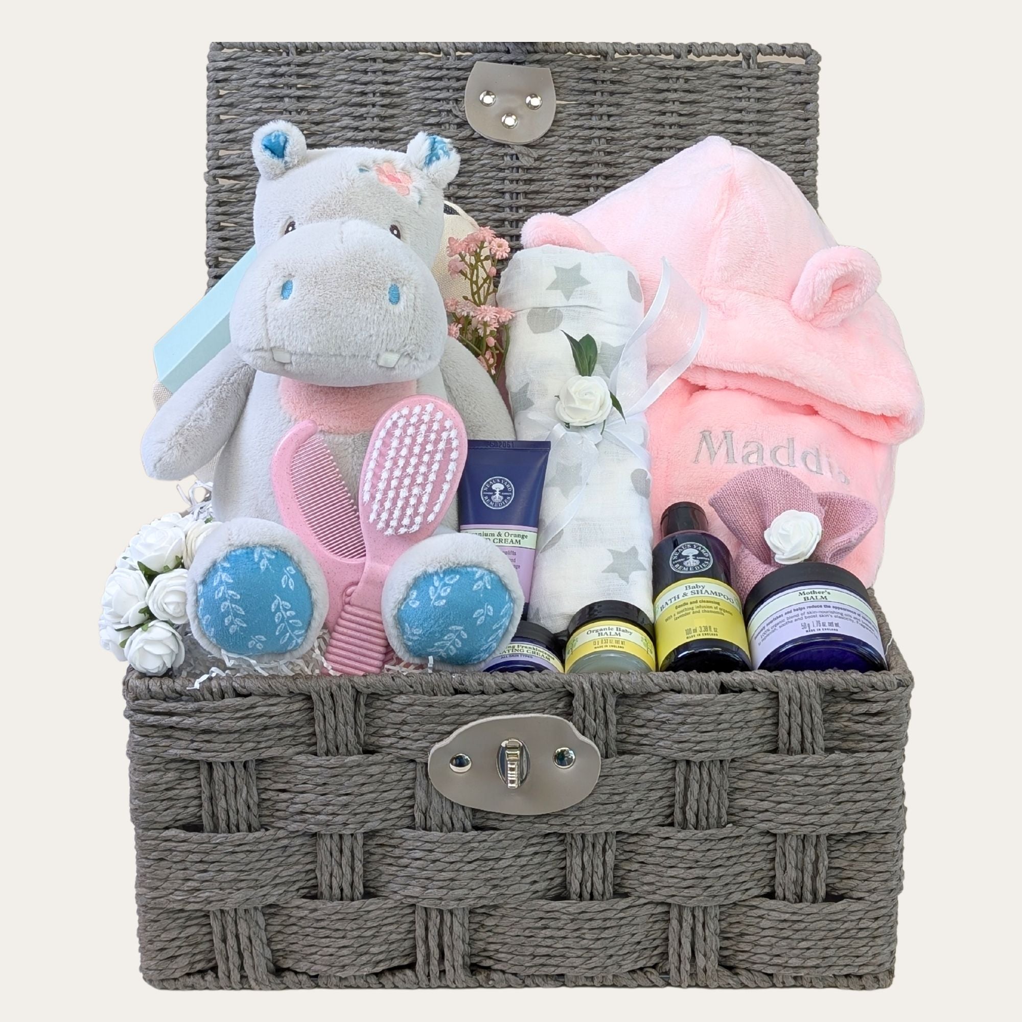 A baby girl gift hamper which can be personalised. Gifts Include hippo soft toy and bath robe. Bumbles and Boo.