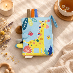 Soft jungle baby book showing colourful animal-themed cloth pages