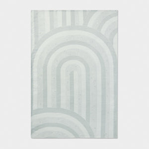 Rectangular rug with a geometric pattern on a light gray background