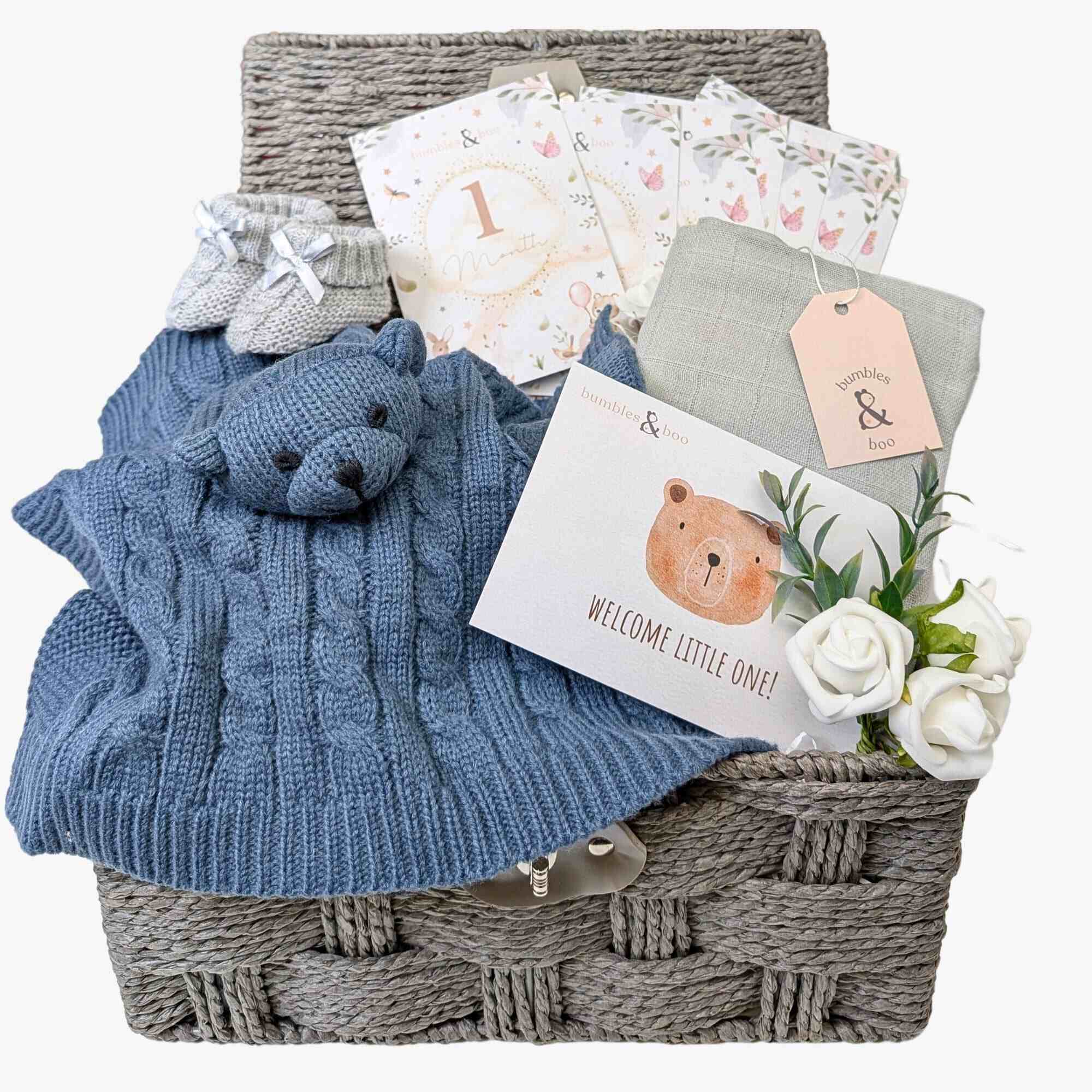 New baby boy gifts basket with dark blue comforter & milestone cards. Hamper designed by Bumbles and Boo.