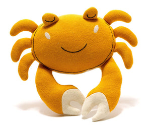 Knitted organic cotton crab baby toy in mustard yellow with soft shell and pincers