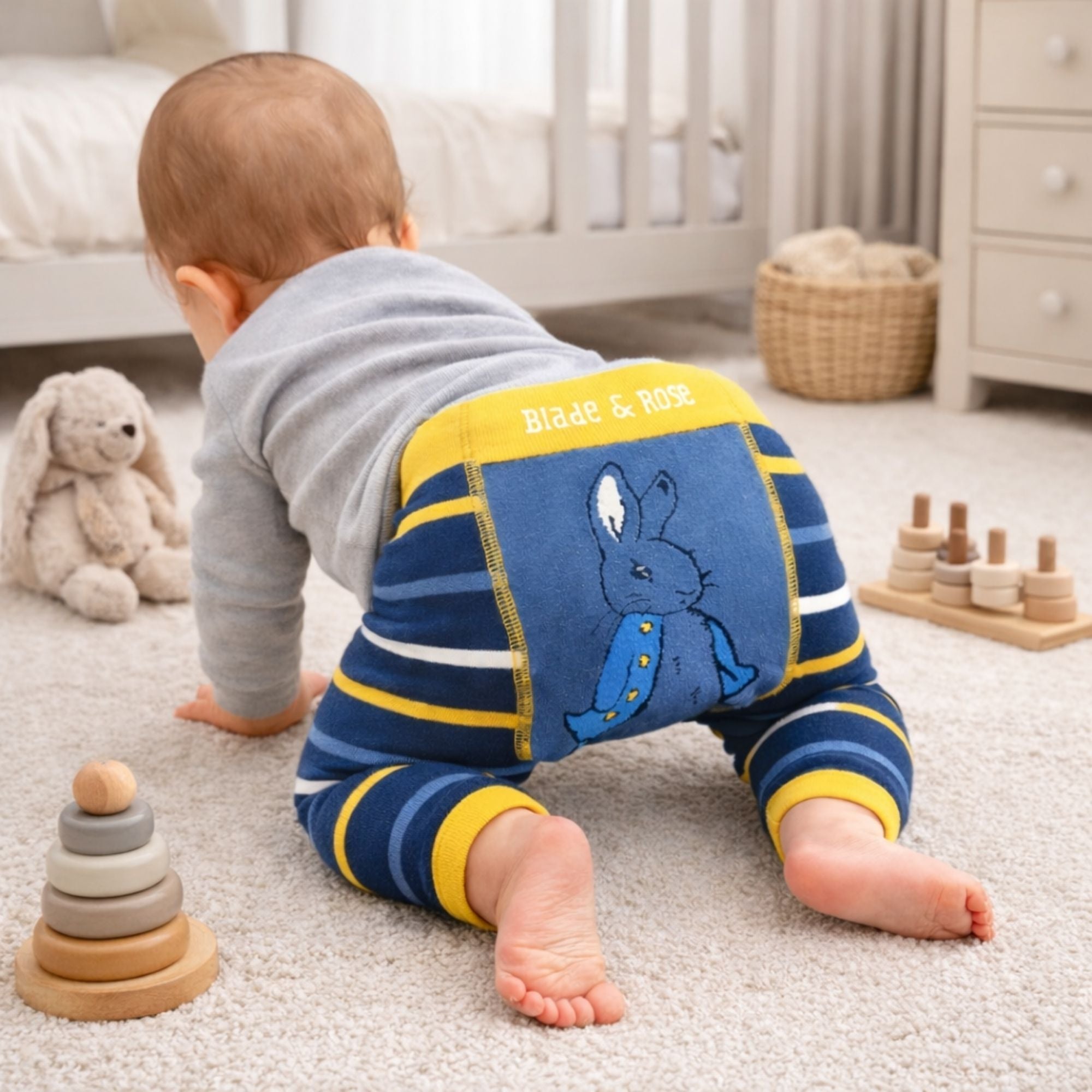 Peter rabbit baby leggings in blue and yellow with peter rabbit on the bottom