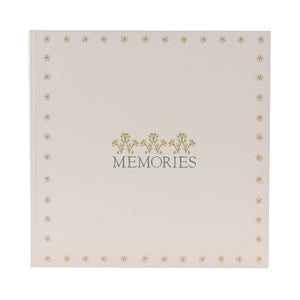 Front view of MEMORIES album with small floral motifs around the cover edge