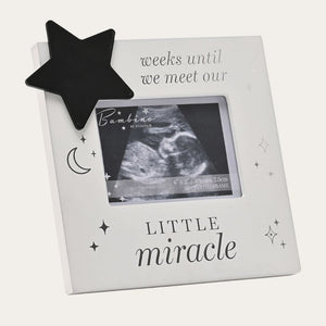 Pregnancy scan frame with a star chalkboard
