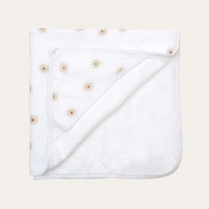 White hooded baby towel with a beige flower design