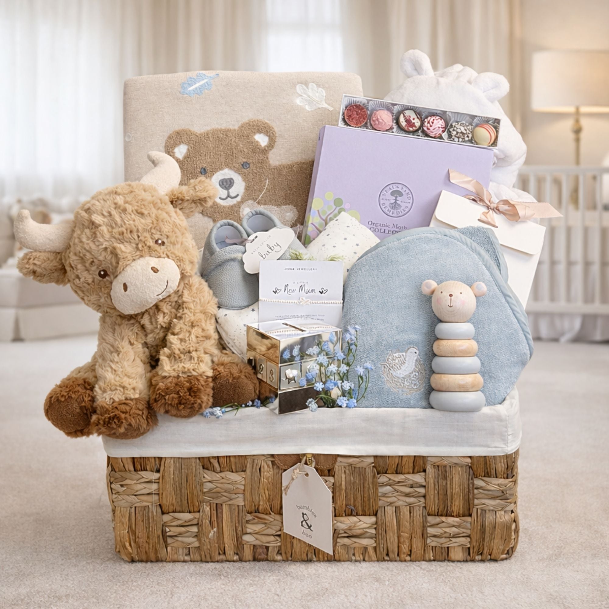 Luxury new mum hamper with a woodland theme and organic skincare gifts for mum.