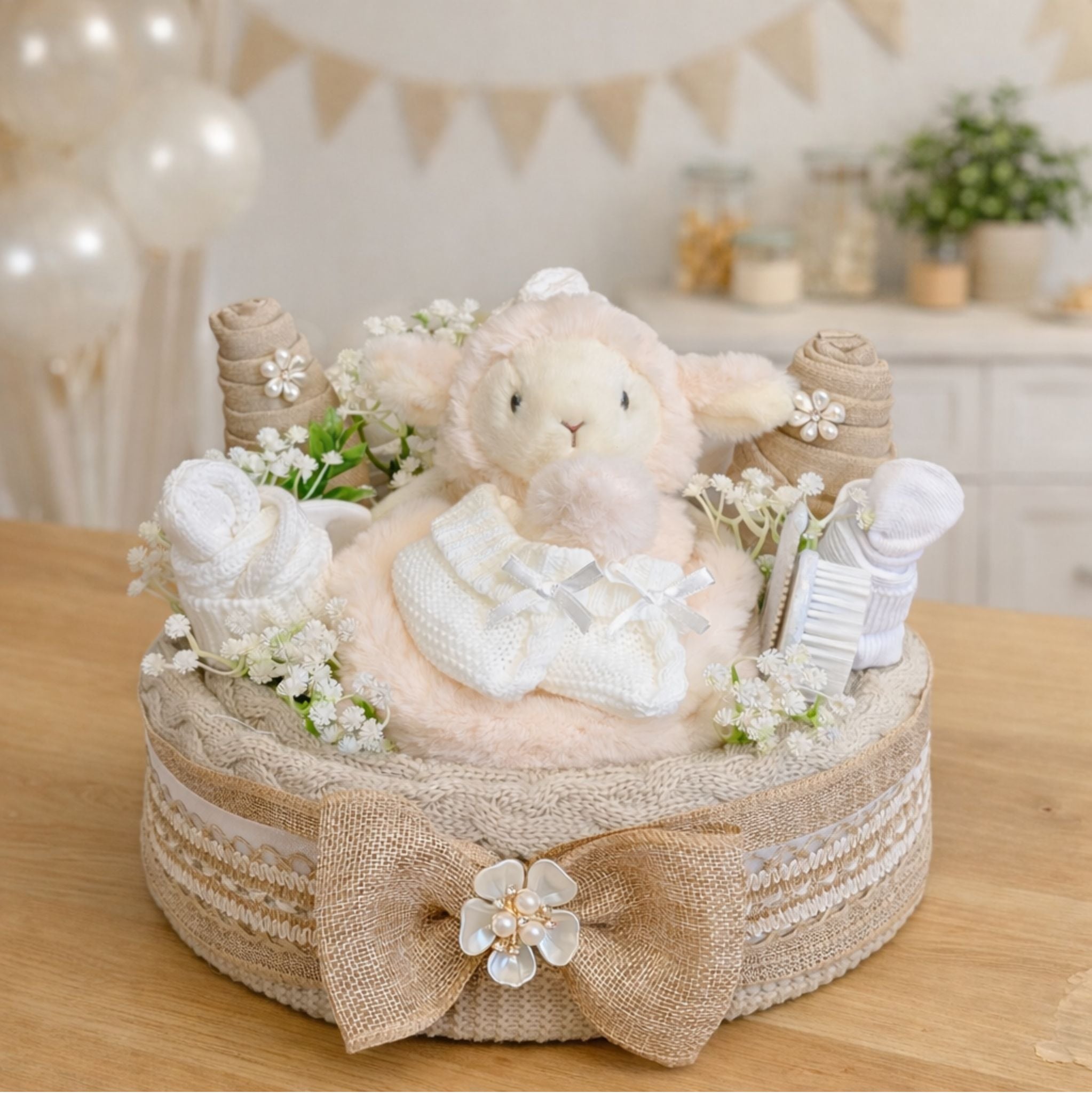 Luxury nappy cake gift for a new baby or new parent presents. Beige and cream colours with blanket.