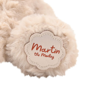 Close up of Martin the Monkey brand label stitched onto soft toy