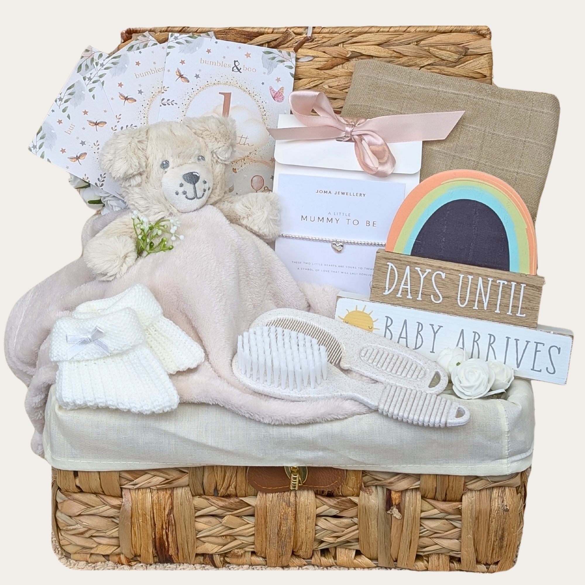 Mother to be hamper gifts in a wicker basket with countdown chalkboard, mummy to be silver bracelet and baby essentials