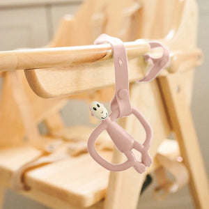 Pink baby strap holder for pushchairs and highchairs