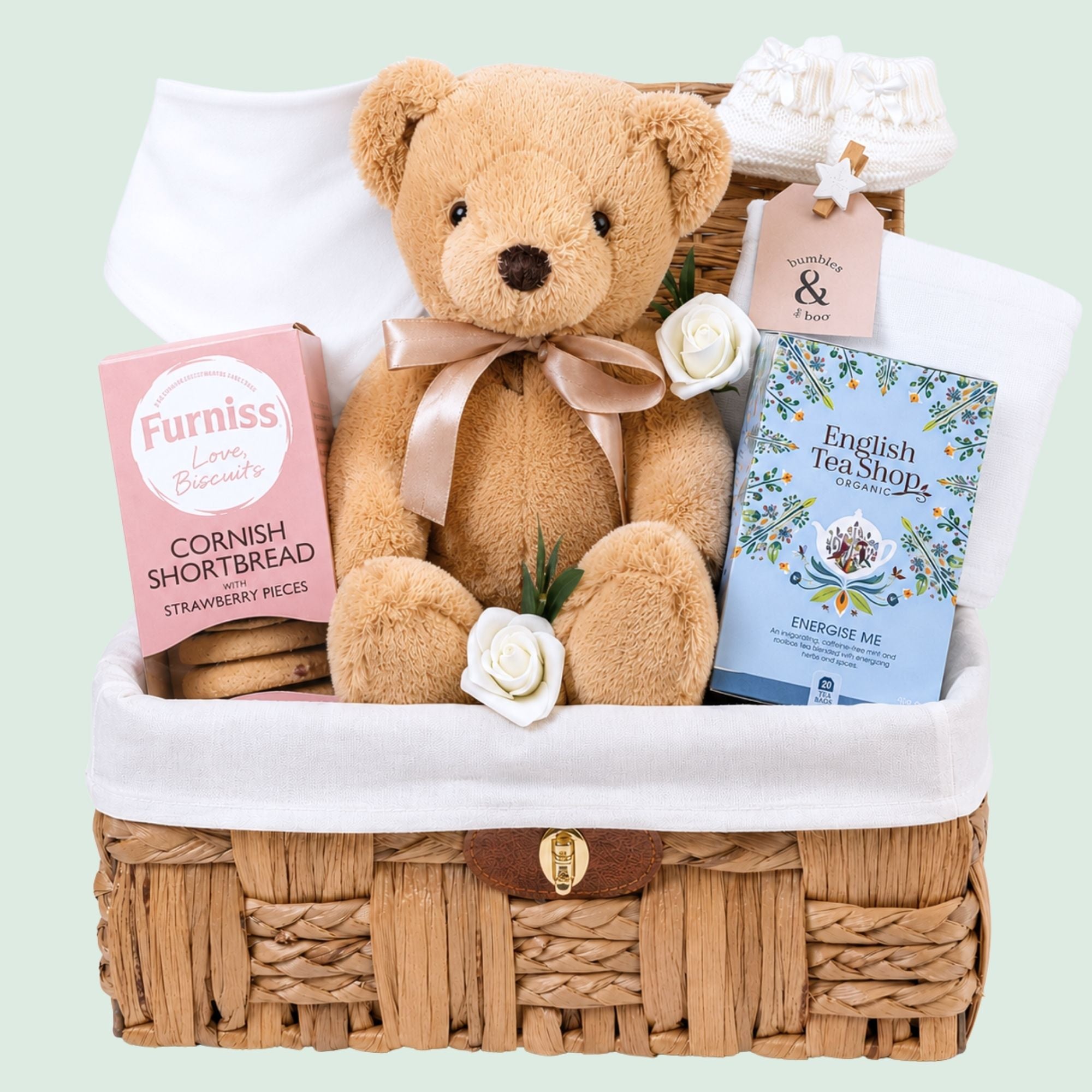 Mum to be hamper basket packed with pregnancy gifts for an expectant mum including snacks, bracelet and baby essentials