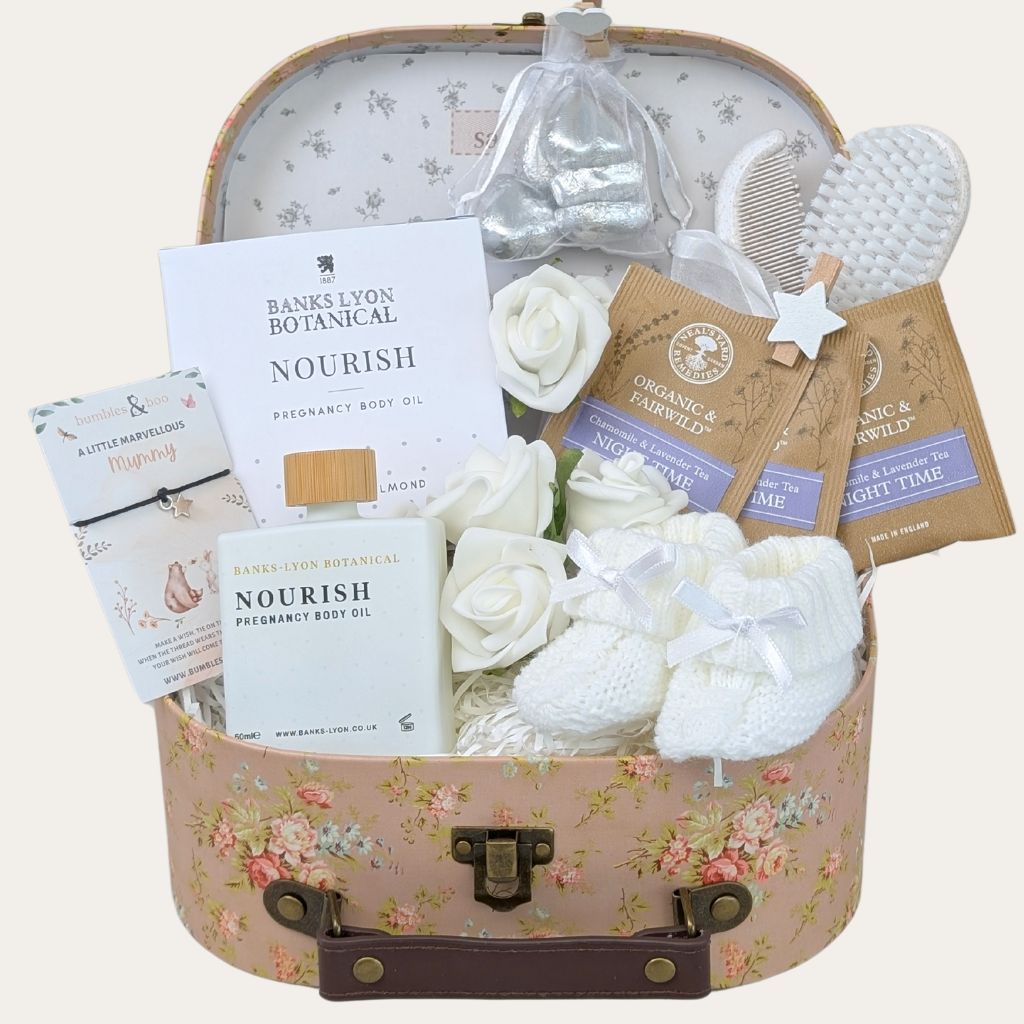 Luxury mum to be gifts trunk with pregnancy body oil and thoughtful pregnancy gifts and presents.